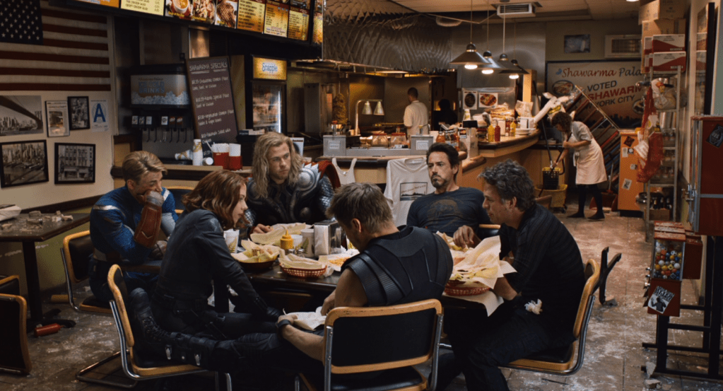 The Avengers (Robert Downey Jr., Chris Hemsworth, Chris Evans) at dinner after fighting Loki