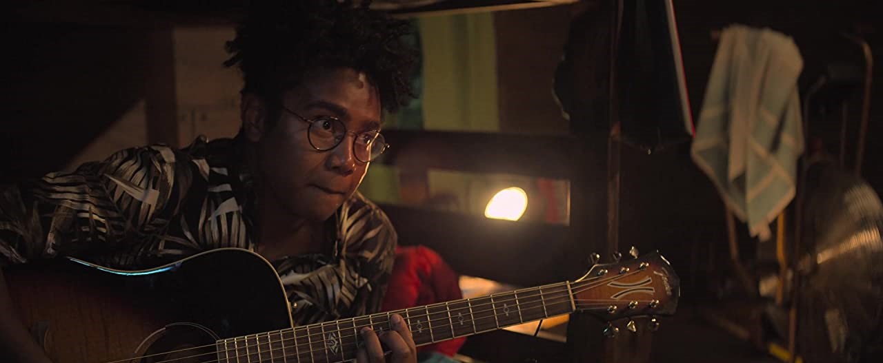 Jahbril Cook playing guitar in Christian Netflix movie A Week Away on Christian Podcast Cinematic Doctrine