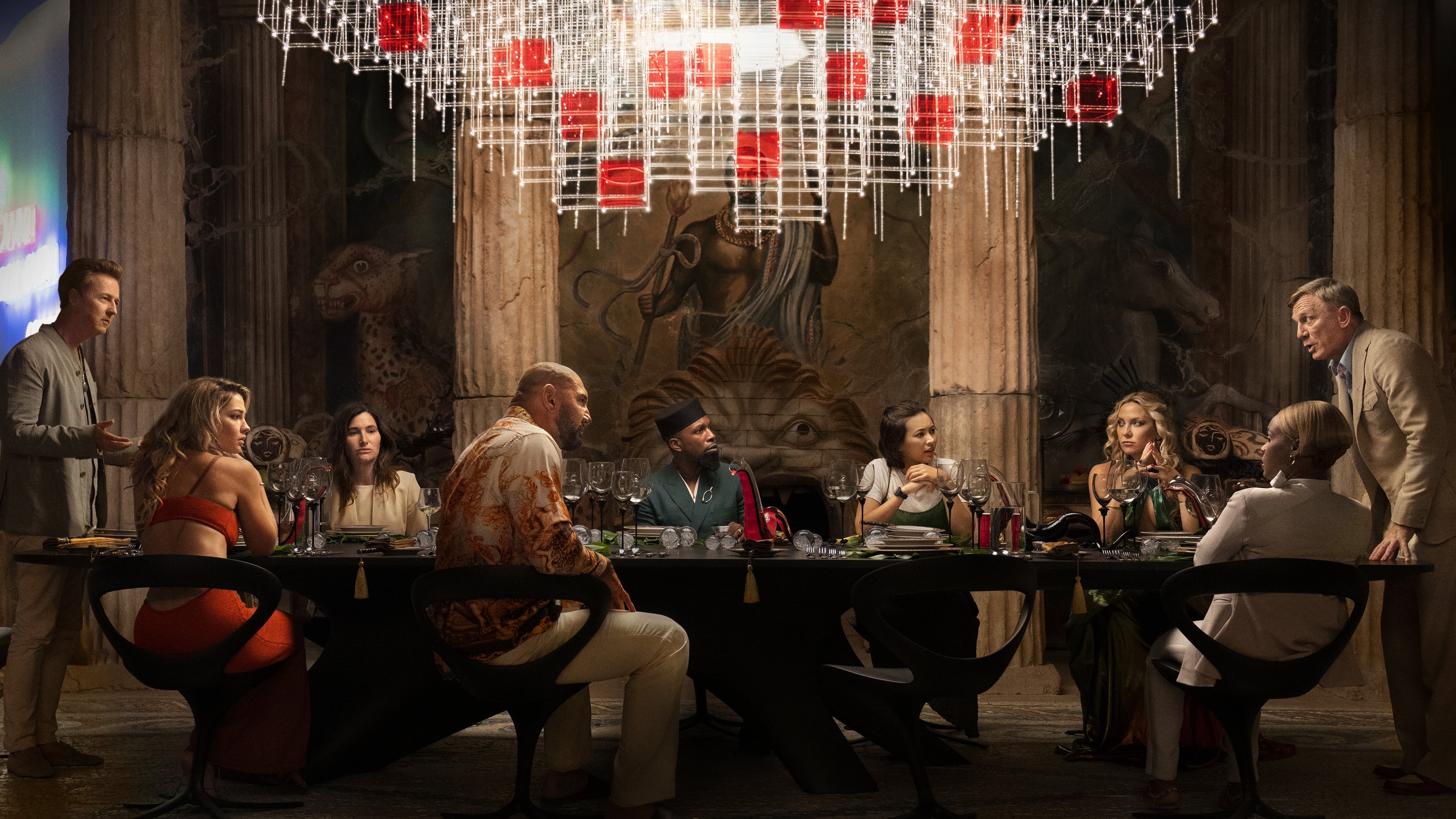 glass onion cast at dinner table